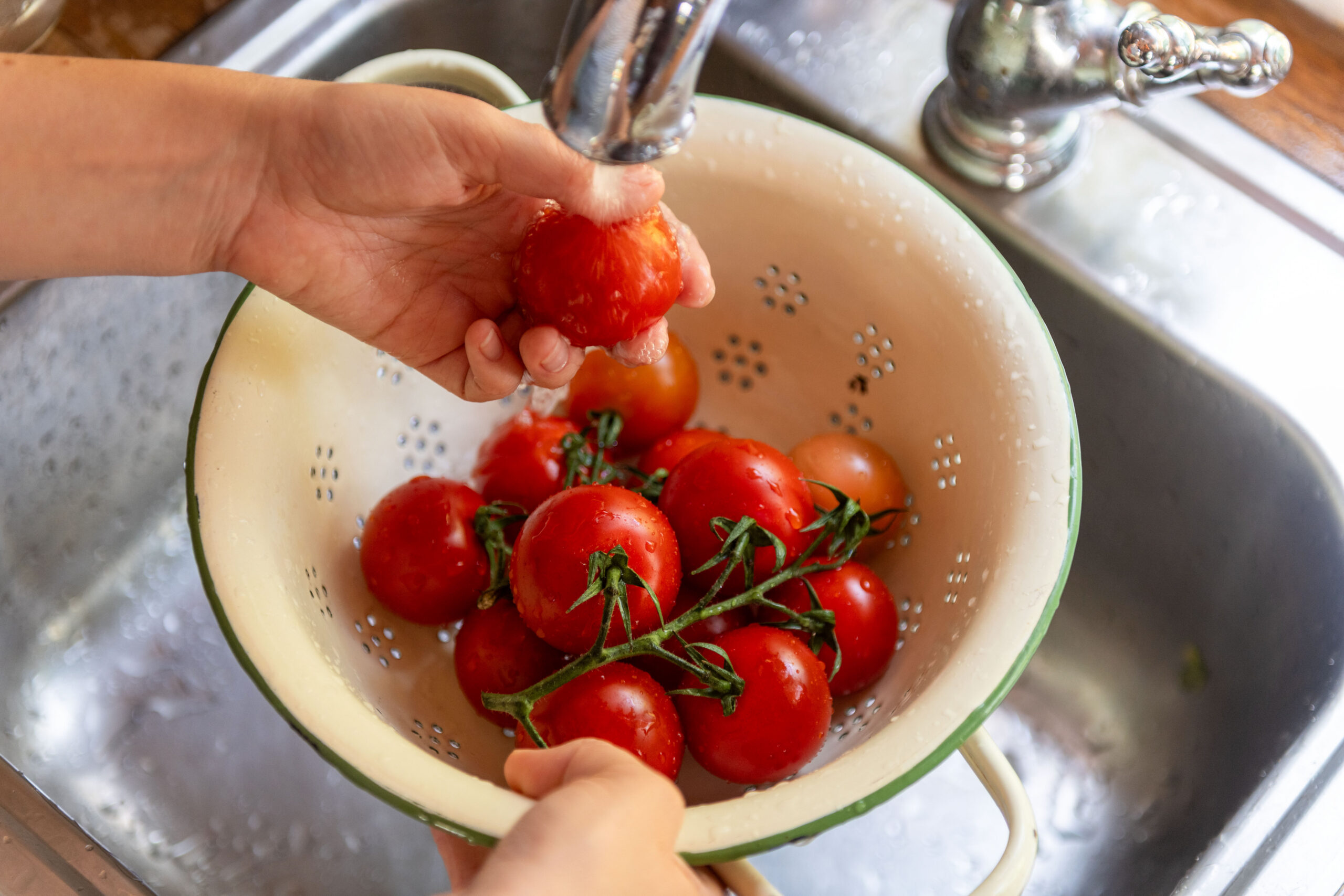Fresh Tomatoes Rinsed In Colander.